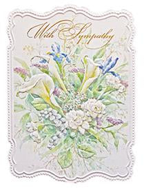 White calla lilies, purple iris, carnations, lily of the valley floral embossed die-cut sympathy greeting card from Carol Wilson Fine Arts. Inside: Thinking of you during this time of sorrow. Retail: $4.99. f 6 CRG1531