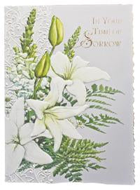 White lilies embossed die-cut sympathy greeting card from Carol Wilson Fine Arts. Inside: Thinking of you in this time of sorrow. Retail: $4.99. f 6 CRG1708